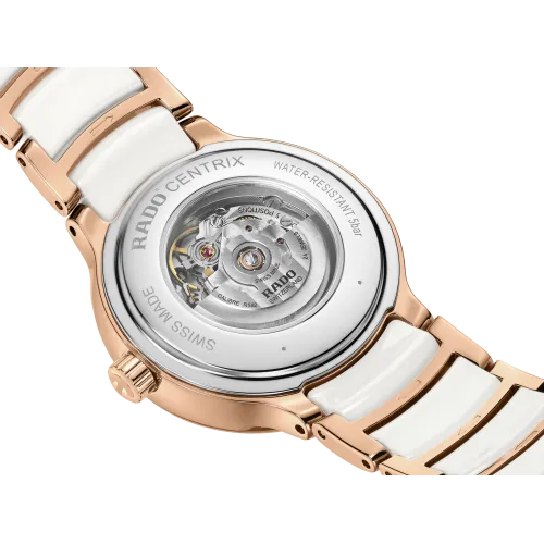 Photo montrant l’entité de la montre Rado Centrix Automatic Diamonds, céramique blanche et rosée.