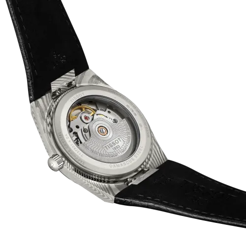 Photo montrant l'intégralité de la montre Montre Tissot PRX Acier Damas 38 mm, Cadran Gris, Bracelet Cuir Noir Grainé