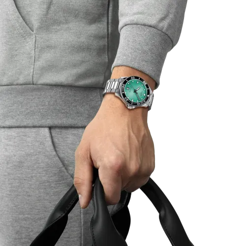 MONTRE TISSOT SEASTAR 1000 40MM CADRAN TURQUOISE BRACELET BICOLORE MÉTAL ARGENTÉ