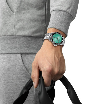 MONTRE TISSOT SEASTAR 1000 40MM CADRAN TURQUOISE BRACELET BICOLORE MÉTAL ARGENTÉ